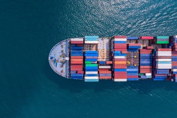 Cargo ship at sea representing Association of Average Adjusters marine examinations