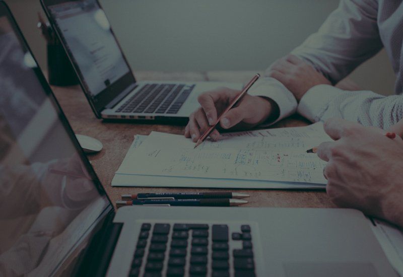 Working professionals organising online assessment 